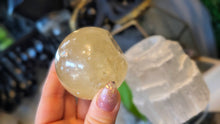 Load image into Gallery viewer, 5.5" Flat Bottom Rainbow Honey Calcite Sphere on Selenite Stand
